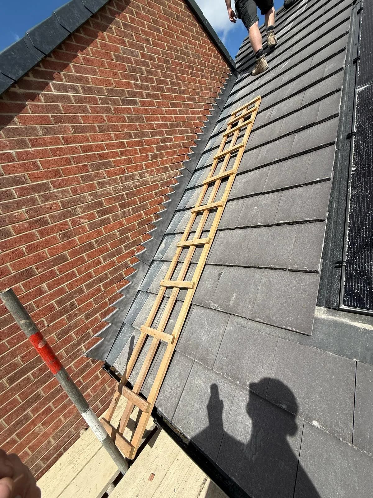 Evenii roofing operatives installing tiles on a new-build plot at Hay Lane, Spennymoor.