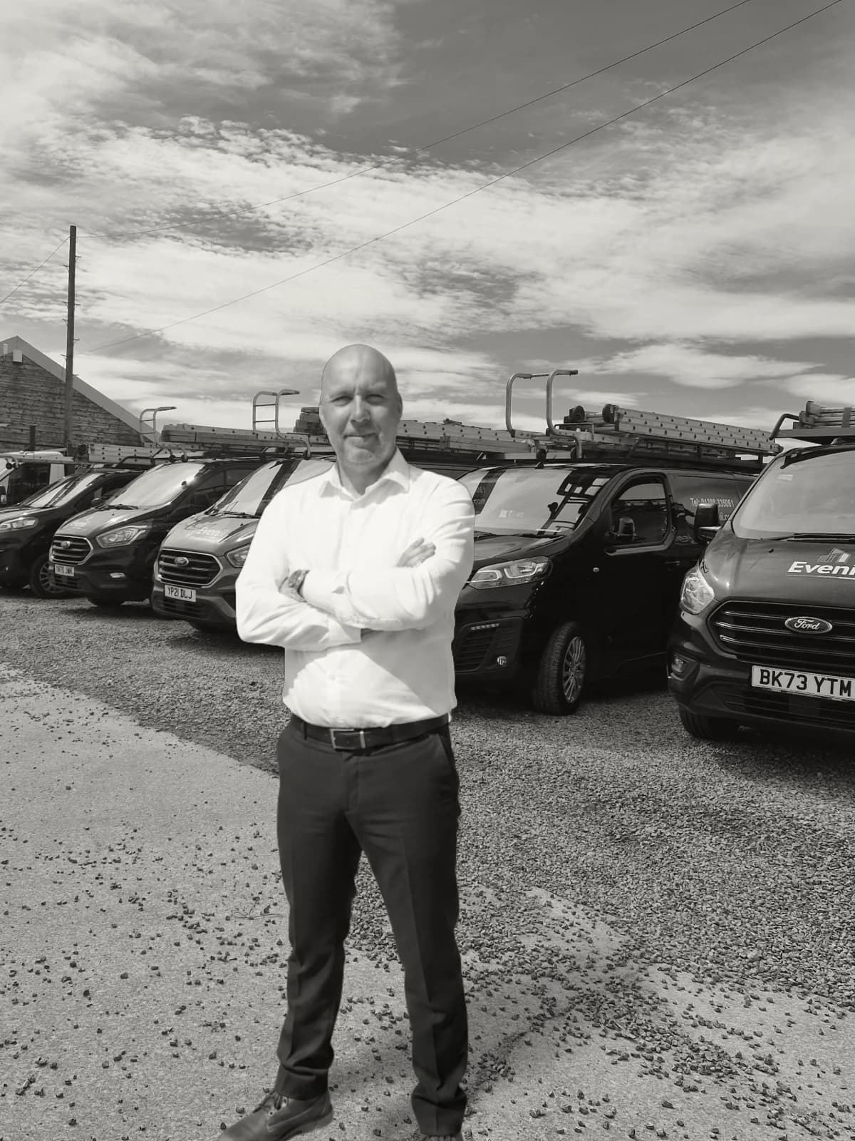 Dean Goyns on site in front of the branded Evenii vehicle fleet